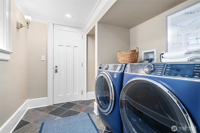 7016 Fremont Ave N, Seattle, WA 98103 - laundry area featuring washing machine and clothes dryer, stone tile flooring, and recessed lighting