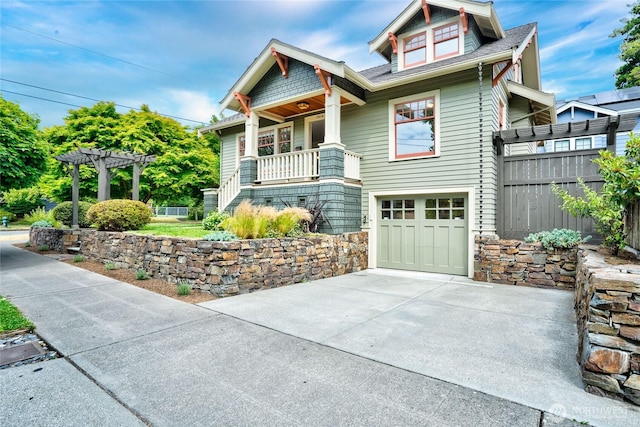 7016 Fremont Ave N, Seattle, WA 98103 - view of front facade with a garage, concrete driveway, a shingled roof, and a pergola
