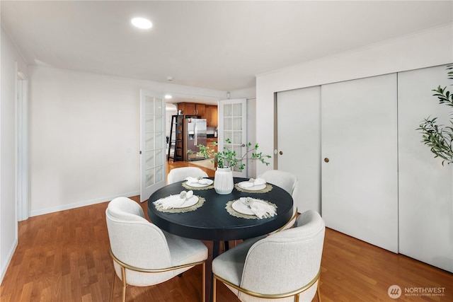 204 Duvall Ave SE, Renton, WA 98059 - dining area with french doors, light wood finished floors, and recessed lighting