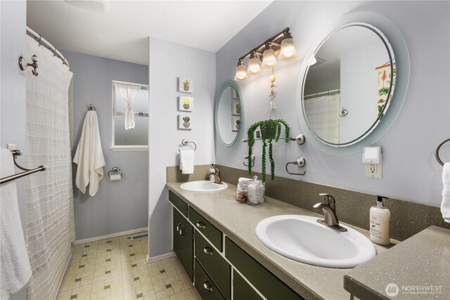 204 Duvall Ave SE, Renton, WA 98059 - full bath with double vanity and tile patterned floors
