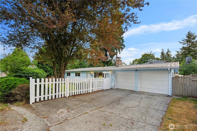 204 Duvall Ave SE, Renton, WA 98059 - ranch-style home with a fenced front yard, a chimney, concrete driveway, and a garage