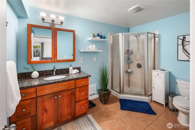 204 Duvall Ave SE, Renton, WA 98059 - bathroom featuring vanity, a stall shower, and tile patterned flooring