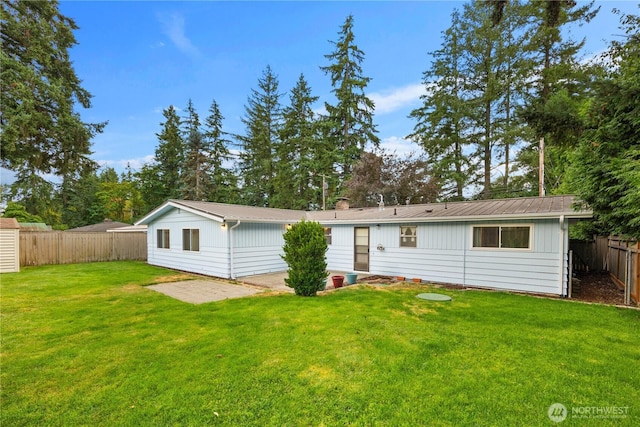 204 Duvall Ave SE, Renton, WA 98059 - rear view of house with a fenced backyard and a patio area