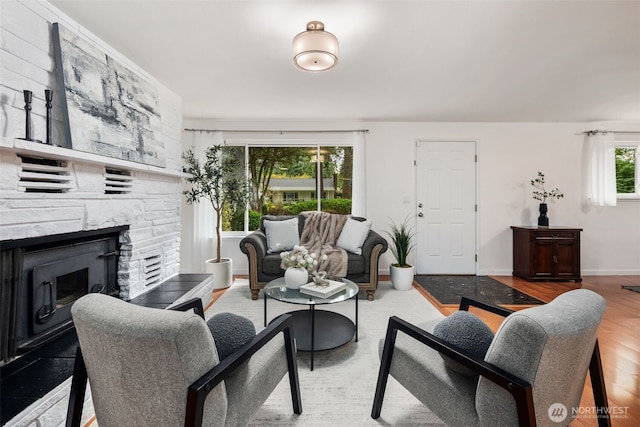 204 Duvall Ave SE, Renton, WA 98059 - living area with a fireplace and wood finished floors