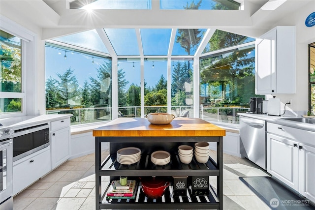 18110 85th St E, Bonney Lake, WA 98391 - sunroom / solarium featuring exterior kitchen and healthy amount of natural light