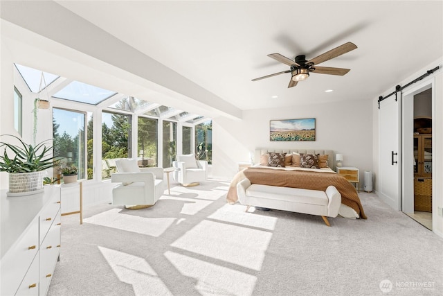 18110 85th St E, Bonney Lake, WA 98391 - bedroom with light colored carpet, a barn door, a skylight, recessed lighting, and a ceiling fan