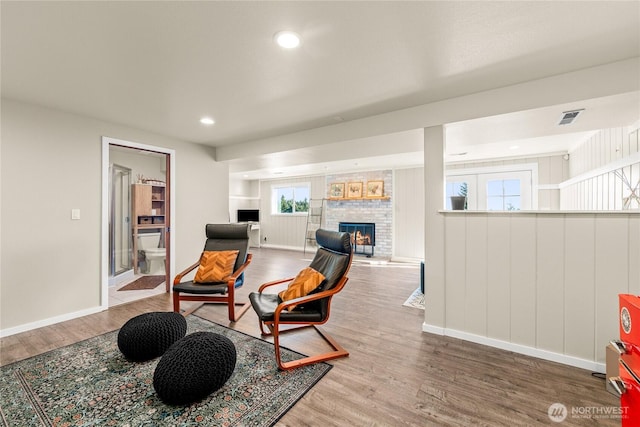18110 85th St E, Bonney Lake, WA 98391 - sitting room featuring a brick fireplace, wood finished floors, and recessed lighting