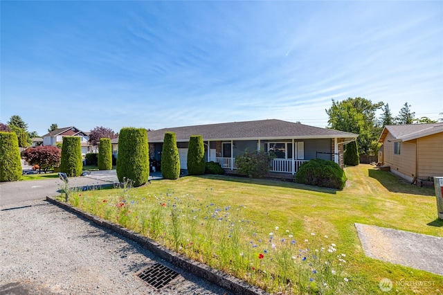 1710 E Highland Ave, Mount Vernon, WA 98273 - view of front of house featuring covered porch and a front yard