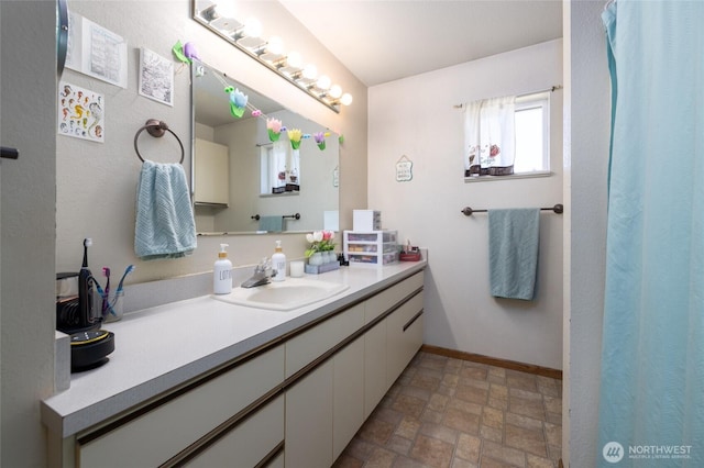 1710 E Highland Ave, Mount Vernon, WA 98273 - bathroom featuring vanity and stone finish floors