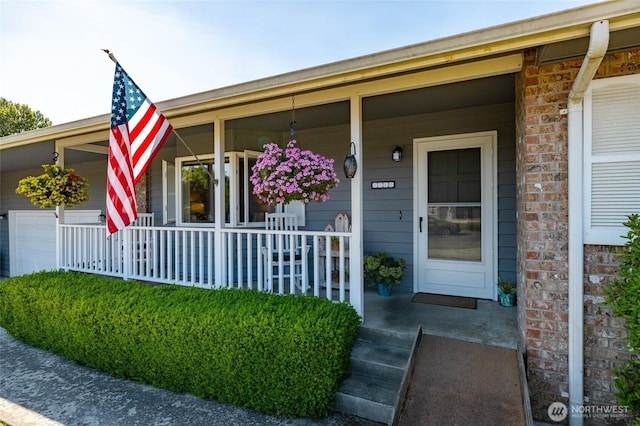 1710 E Highland Ave, Mount Vernon, WA 98273 - entrance to property with covered porch, an attached garage, and brick siding