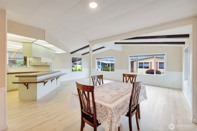 1402 22nd St NE Unit 86, Auburn, WA 98002 - dining room featuring light wood finished floors and wainscoting