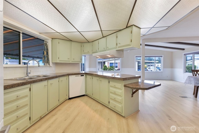 1402 22nd St NE Unit 86, Auburn, WA 98002 - kitchen with white dishwasher, light wood-style floors, a peninsula, open floor plan, and wainscoting