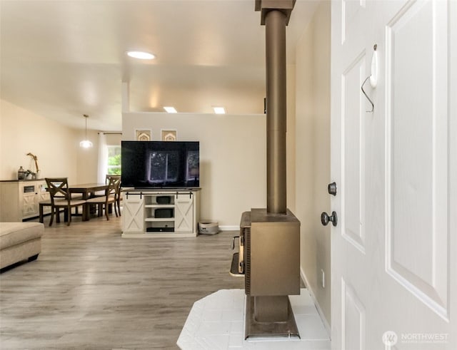 15816 251st St E, Graham, WA 98338 - living room with a wood stove and wood finished floors