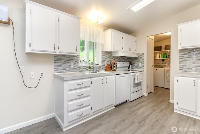 15816 251st St E, Graham, WA 98338 - kitchen featuring white appliances, under cabinet range hood, independent washer and dryer, backsplash, and light countertops