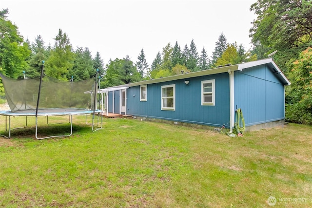15816 251st St E, Graham, WA 98338 - back of property with a trampoline and a yard