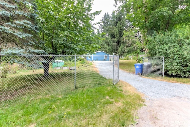 15816 251st St E, Graham, WA 98338 - view of dirt / gravel road with a gated entry