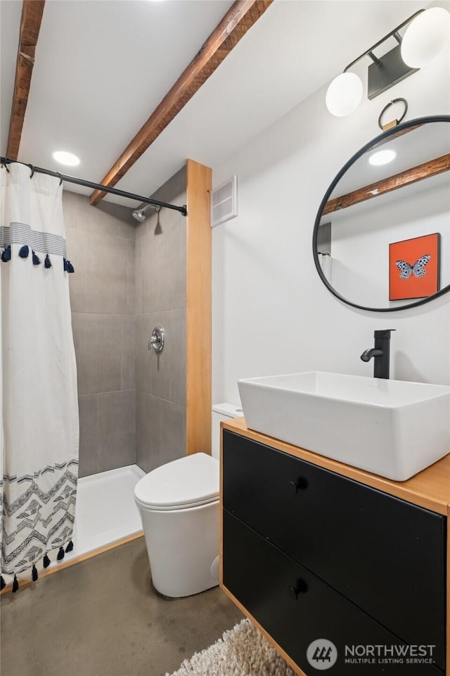 3211 16th Ave S, Seattle, WA 98144 - bathroom with vanity, concrete flooring, tiled shower, and beam ceiling
