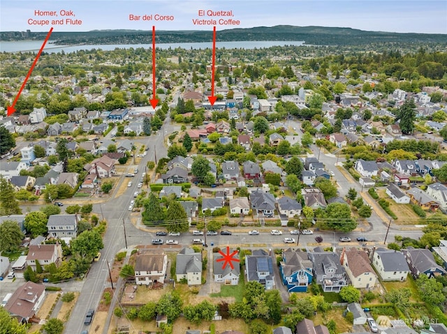 3211 16th Ave S, Seattle, WA 98144 - aerial view of property and surrounding area with nearby suburban area and a nearby body of water