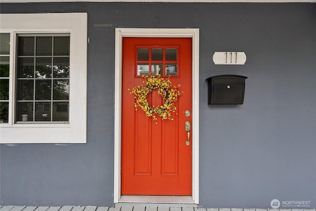 111 27th Ave S, Seattle, WA 98144 - doorway to property featuring stucco siding