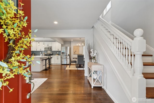111 27th Ave S, Seattle, WA 98144 - entrance foyer featuring dark wood-style flooring, stairway, recessed lighting, and a chandelier