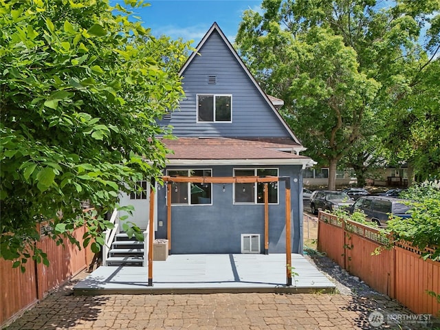 111 27th Ave S, Seattle, WA 98144 - back of property with a deck and roof with shingles