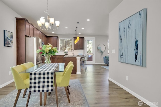11103 5th Ave SW, Seattle, WA 98146 - dining room featuring recessed lighting, a chandelier, and wood finished floors