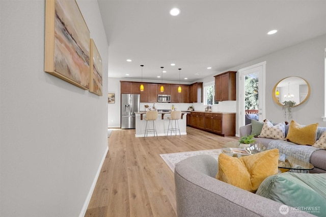 11103 5th Ave SW, Seattle, WA 98146 - living room featuring recessed lighting and light wood-type flooring