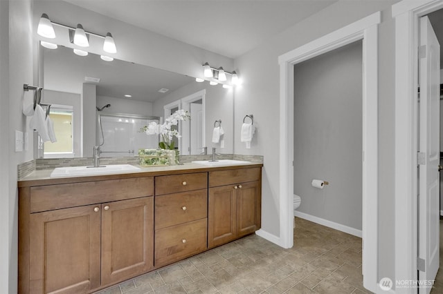 11103 5th Ave SW, Seattle, WA 98146 - bathroom with a stall shower and double vanity