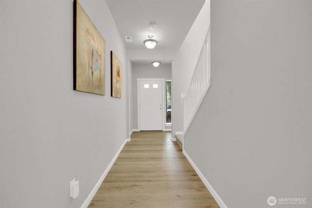 11103 5th Ave SW, Seattle, WA 98146 - doorway with light wood-style flooring and baseboards