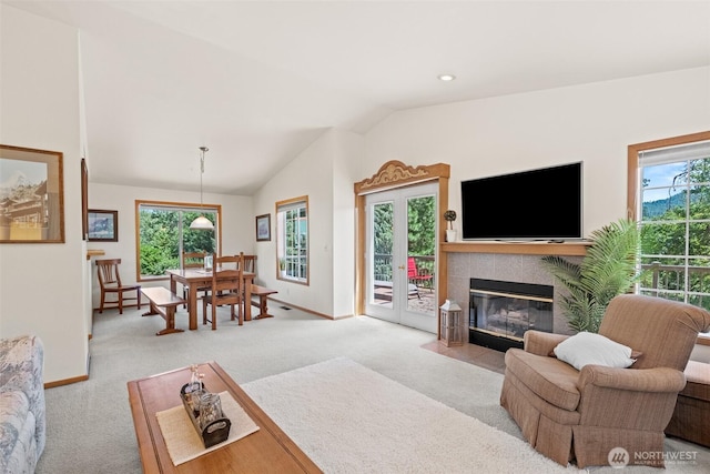 106 River St, Leavenworth, WA 98826 - living area featuring carpet floors, vaulted ceiling, and a fireplace