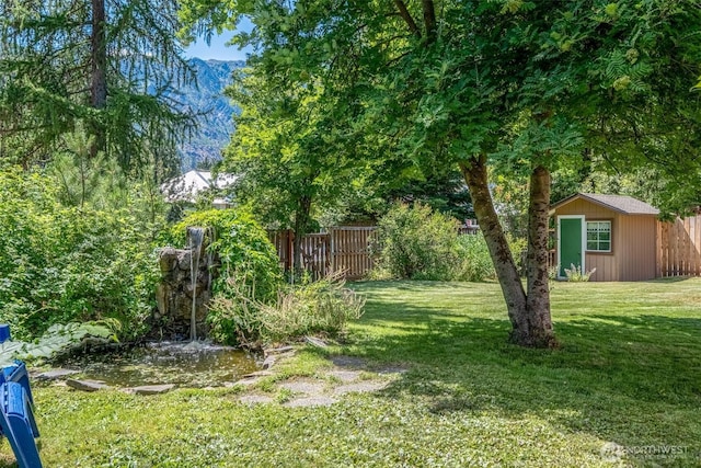 106 River St, Leavenworth, WA 98826 - view of yard with a shed and a mountain view
