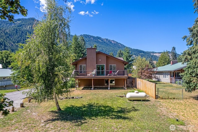 106 River St, Leavenworth, WA 98826 - back of house with a deck with mountain view and a chimney