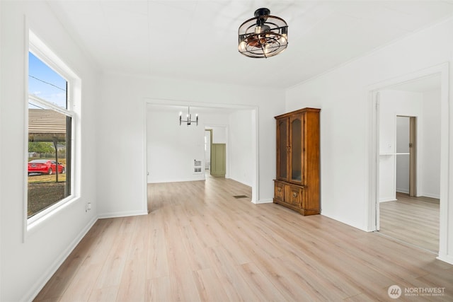2104 Stuart St, Raymond, WA 98577 - spare room with a chandelier and light wood finished floors