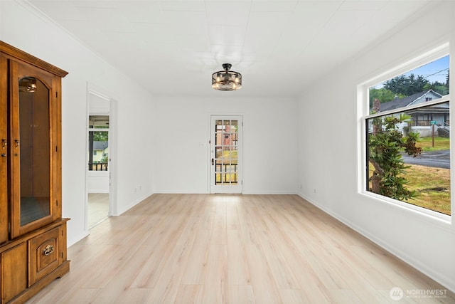 2104 Stuart St, Raymond, WA 98577 - spare room featuring light wood-type flooring and baseboards