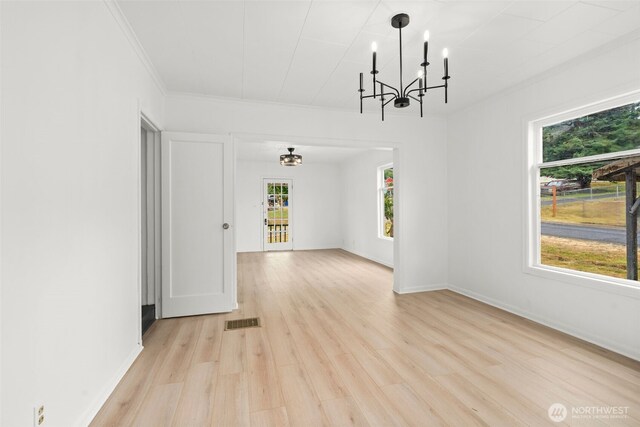 2104 Stuart St, Raymond, WA 98577 - unfurnished room featuring a chandelier, light wood finished floors, and ornamental molding