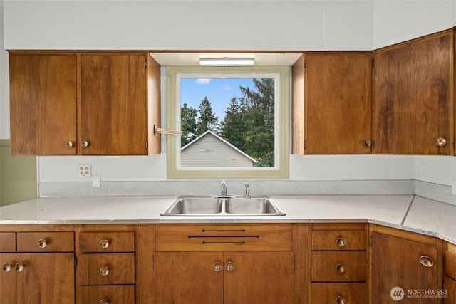 2104 Stuart St, Raymond, WA 98577 - kitchen featuring light countertops and brown cabinetry