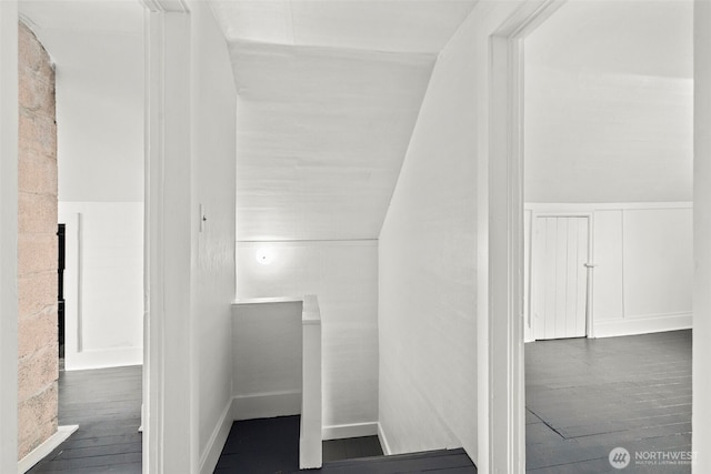 2104 Stuart St, Raymond, WA 98577 - staircase featuring wood finished floors and a wainscoted wall