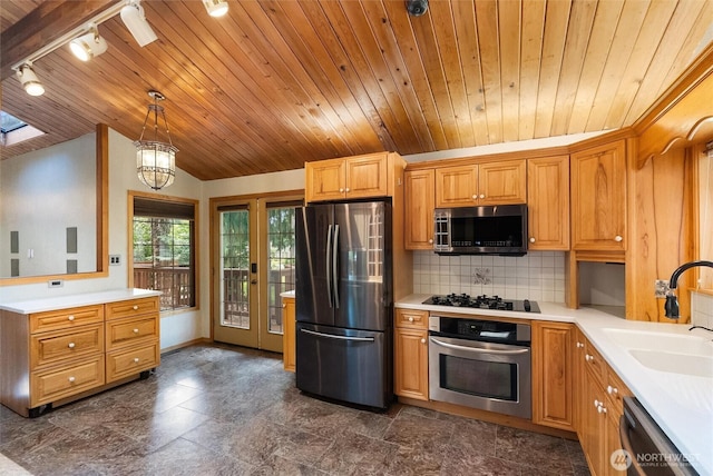 383 E Piper Way, Camano Island, WA 98282 - kitchen with stainless steel appliances, track lighting, wooden ceiling, light countertops, and vaulted ceiling
