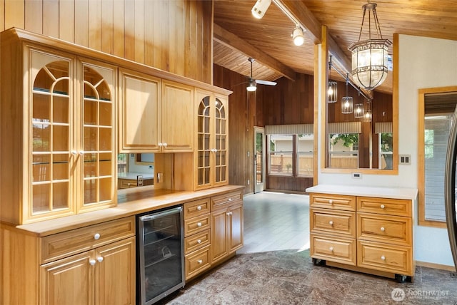 383 E Piper Way, Camano Island, WA 98282 - kitchen with wine cooler, wood ceiling, wooden walls, glass insert cabinets, and light countertops