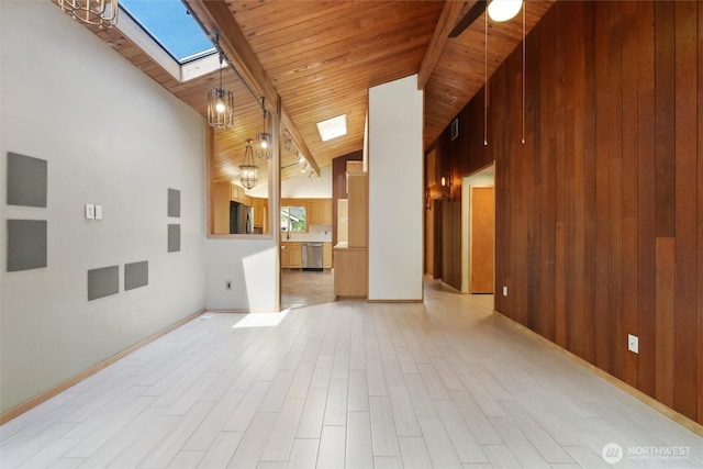 383 E Piper Way, Camano Island, WA 98282 - unfurnished living room featuring a skylight, high vaulted ceiling, light wood finished floors, and wooden ceiling