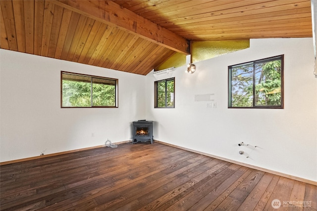 383 E Piper Way, Camano Island, WA 98282 - unfurnished room featuring a wood stove, hardwood / wood-style floors, and wood ceiling