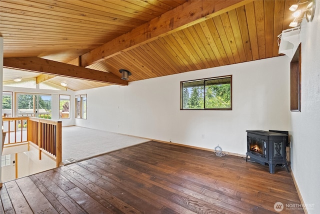 383 E Piper Way, Camano Island, WA 98282 - unfurnished living room with a wood stove, plenty of natural light, and hardwood / wood-style flooring