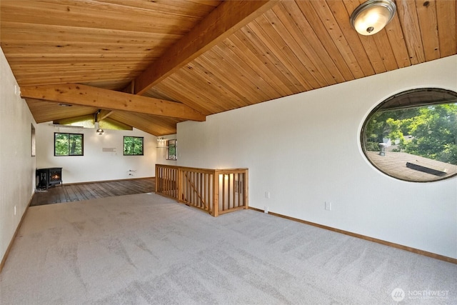 383 E Piper Way, Camano Island, WA 98282 - empty room with carpet floors, a wood stove, and wood ceiling
