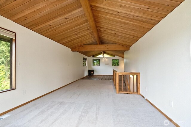 383 E Piper Way, Camano Island, WA 98282 - unfurnished living room featuring wooden ceiling, carpet flooring, and healthy amount of natural light