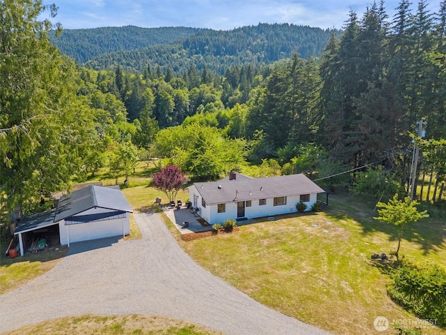 1173 Grauel Ramapo Rd, Port Angeles, WA 98363 - aerial view of property and surrounding area featuring a heavily wooded area and mountains