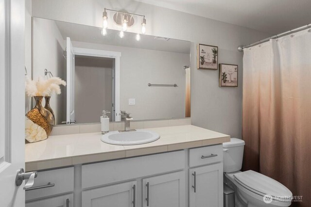 19042 123rd Ave SE, Renton, WA 98058 - bathroom featuring vanity and curtained shower
