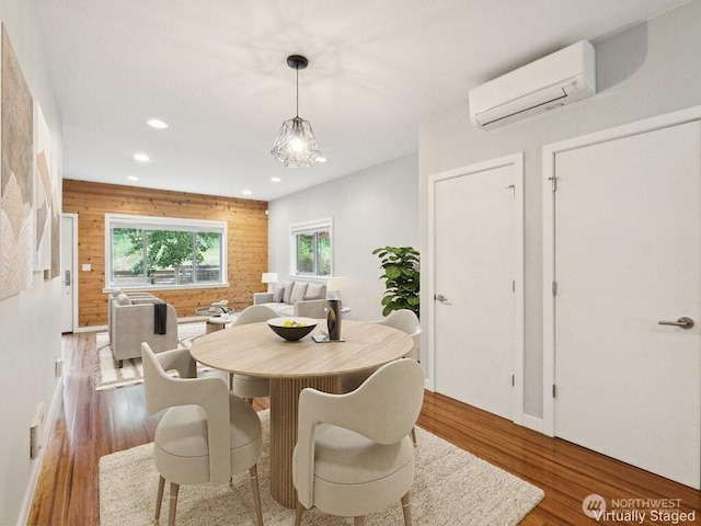 4214 S Trenton St, Seattle, WA 98118 - dining area featuring an AC wall unit, wood finished floors, and recessed lighting