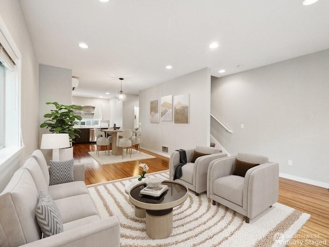 4214 S Trenton St, Seattle, WA 98118 - living room with wood finished floors, stairs, recessed lighting, and healthy amount of natural light