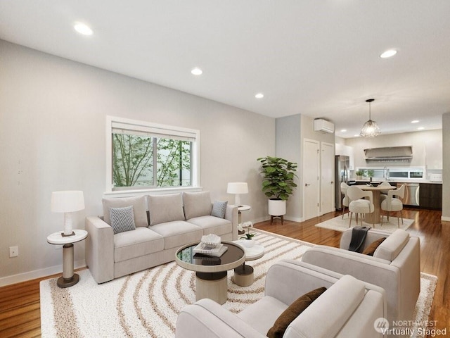4214 S Trenton St, Seattle, WA 98118 - living room with recessed lighting, wood finished floors, and a wall mounted air conditioner