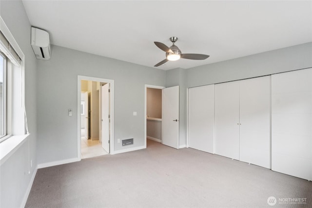 4214 S Trenton St, Seattle, WA 98118 - unfurnished bedroom with a wall mounted air conditioner, light colored carpet, a closet, and a ceiling fan